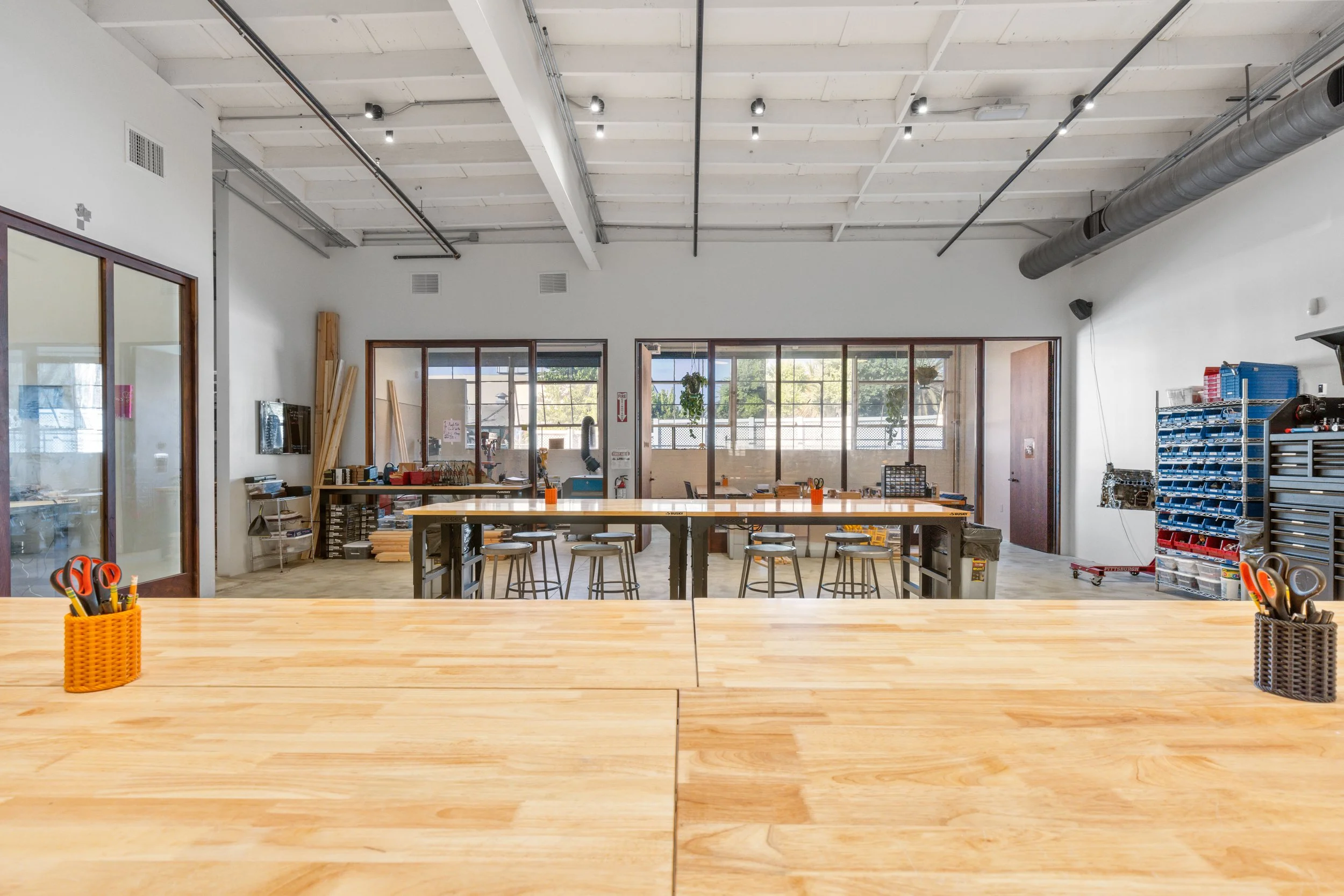 Inside the Forge workshop — workbenches, tool storage, and machines in the Santa Monica space.